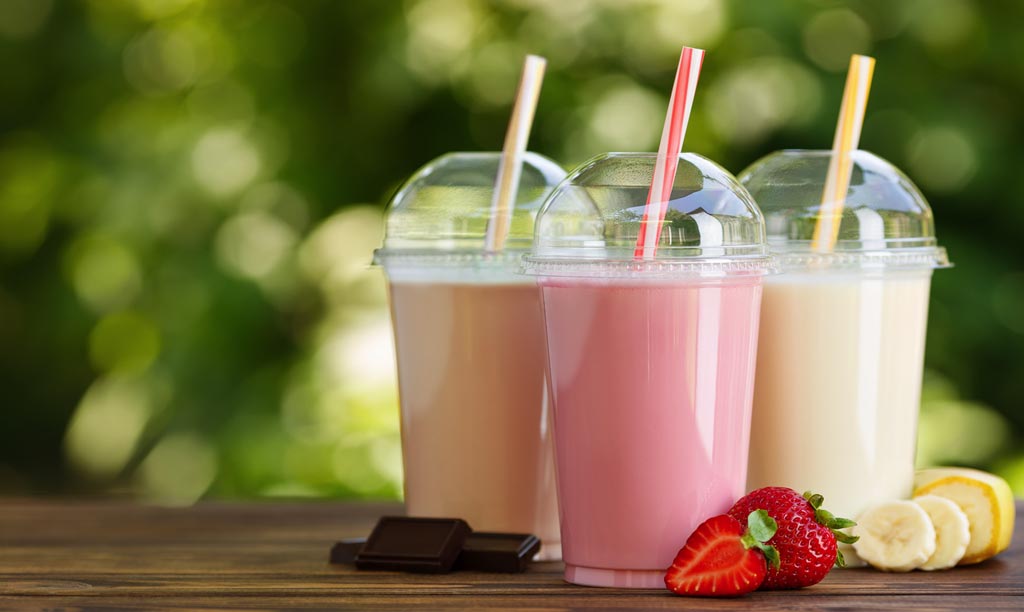 Three milkshakes on a table