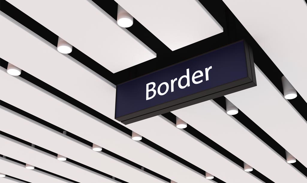 Border sign hanging from ceiling in a customs, border force setting